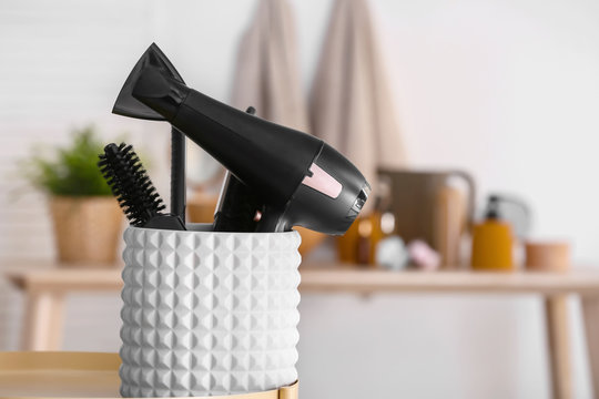 Modern blow dryer and hairdresser tools in salon