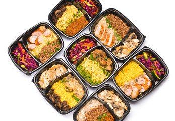 Containers with healthy food on white background