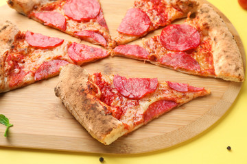 Tasty pizza on wooden board