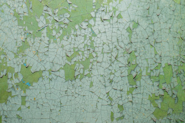Old painted wall with cracked paint