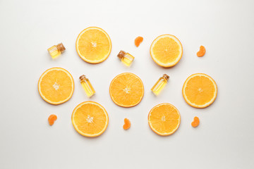 Composition with citrus essential oils on white background
