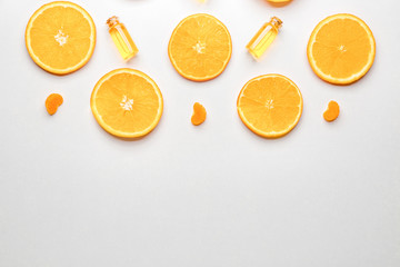 Composition with citrus essential oils on white background