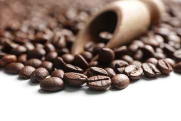 Many coffee beans on white background, closeup