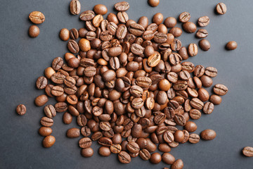 Many coffee beans on dark background