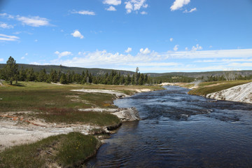 river running through valleys