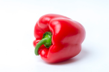 Close-Up Of Red Bell Pepper Against White Background