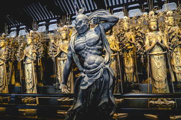 Guardian and Thousand Armed Kannon sculptures at Buddhist temple (Sanjusangendo Temple), Kyoto