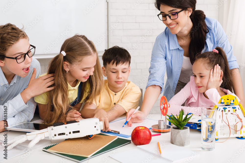 Poster stem education. children studying at robotic class, making notes
