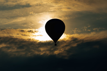 hot air balloon silhouette at sunset. Adventure concept.