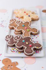 Pattern of traditional handmade smiling biscuits gingerbread men cookies