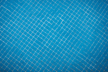 Fototapeta na wymiar Swimming pool tiled floor in blue with a zenith view