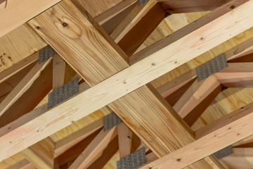 The structure of the new frame house. Close-up of wooden structures