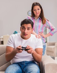 Young family suffering from computer games addiction