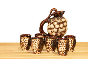 Souvenir from Moldova - Ceramic jugs and cups. On white background