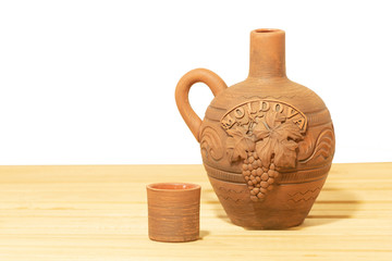 Souvenir from Moldova - Ceramic jug and aup on white background