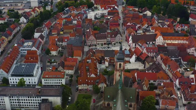 Aerial of the city Tauberbischofsheim in Germany. Descending beside the church with tilt up