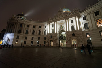 Fototapeta premium St Michael Wing of Hofburg Palace at Vienna mist evening