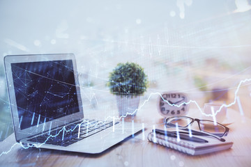 Forex Chart hologram on table with computer background. Multi exposure. Concept of financial markets.