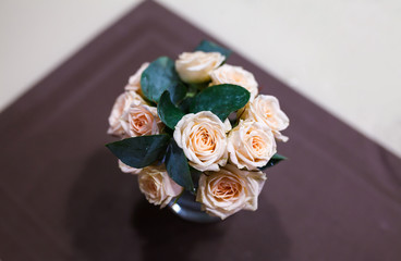 bouquet of small pink roses on a dark napkin. Womens Day concept