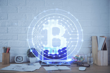 Multi exposure of blockchain and crypto economy theme hologram and table with computer background....
