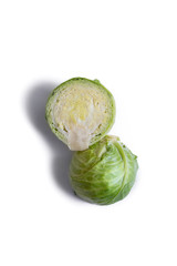 Tasty fresh nutritious healthy green sliced cabbage on a white background. Vegan food. Plant Vitamins. Vegetarian diet healthy eating. and isolated. Top view