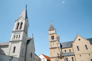 Fototapeta na wymiar Franciscan Church and Saint Michael's Cathedral and Holy Trinity Column at castle district in Veszprem, Hungary