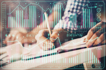 Multi exposure of two men planing investment with stock market forex chart.