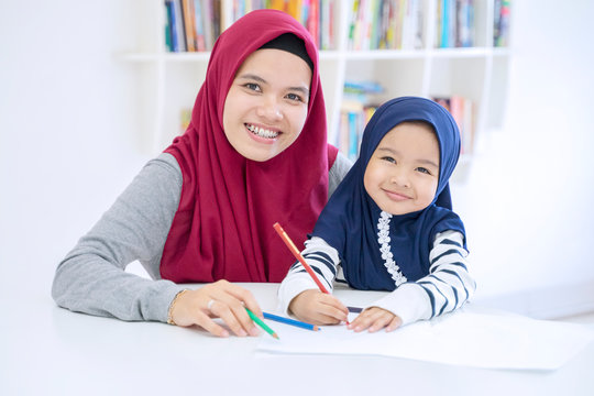 Beautiful Muslim Mother And Daughter Studying