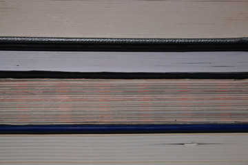 A close up of the different pages all-in different colors of four different books