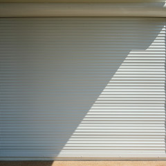 white roller shutter door closed security in modern house
