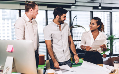 Group of professional business meeting and discussing strategy with new startup project.Creative business people planning and brainstorm with document report in modern workloft.Teamwork concept