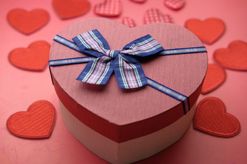 Close up of heart shape gift box on table 