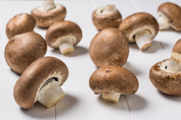 Freshly picked Royal mushrooms on a white wooden table. Vegetarian food.