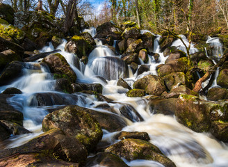 Fototapeta na wymiar Raging torrent waterfalls in Dartmoor, Devon