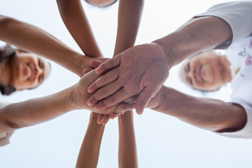 Asian family standing hands support together. Family generation join hands showing unity and teamwork.