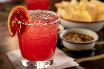 Blood orange margarita with chips and salsa