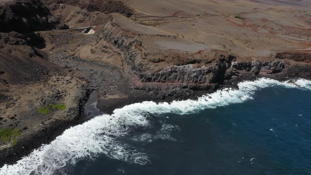 drone footage of desert cliff and beach in Maui, Hawaii