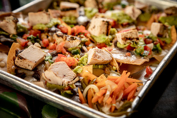 Chicken chunk tacos on silver platter