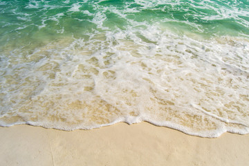 Turquoise waters flowing over the shore