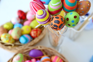 Fototapeta na wymiar Colorful handmade easter eggs in the basket 