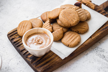 Crispy peanut butter cookies. Homemade vegan dessert. Vegan and vegetarian healthy food. On wooden board