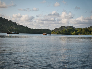sink boat on lake