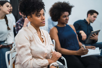 Creative business people listening to colleague.