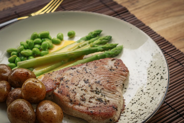 Grilled tuna steak served with asparagus
