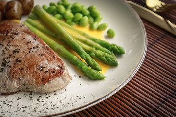 Grilled tuna steak served with asparagus