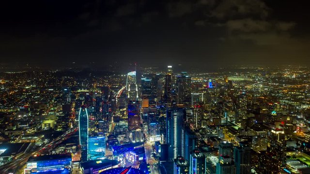 Los Angeles Aerial v250 Hyperlapse, ascending shot from blue lit South Park downtown district to wider cityscape at night with ominous sky - October 2019