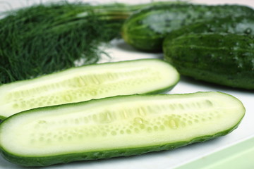 Cucumbers and dill on cutting board