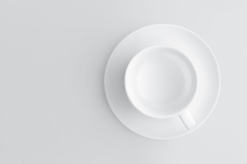 Top view of an empty coffee cup on a saucer on a gray background with copy space