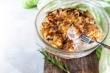 casserole from cauliflower with bechamel sauce in a glass baking dish.