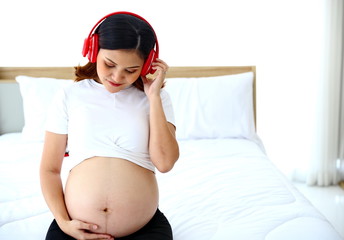 Young man taking care of young wife while pregnant